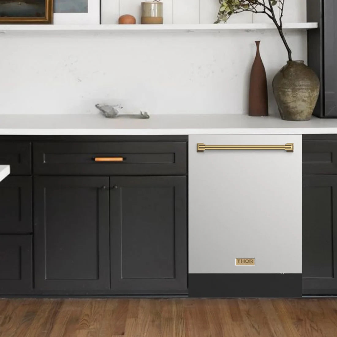 A Gordon Ramsay by Thor dishwasher model DW24X8BA99 in bronze accents, shown in a modern kitchen setting with the door closed.