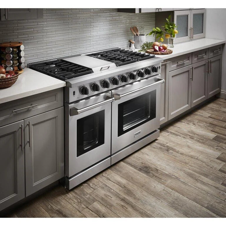 Closed side view of Thor 48-Inch Gas Range LRG4807U, showcasing Dual Ovens, 15,000 BTU Griddle, Italian-Made Burners, and Stainless Steel Finish in modern kitchen 